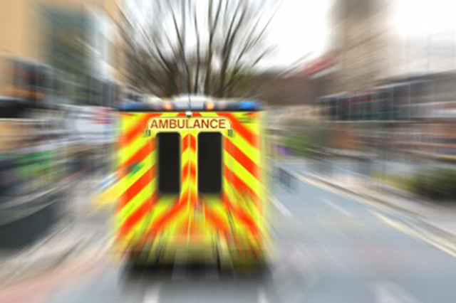 NHS ambulance racing talong road
